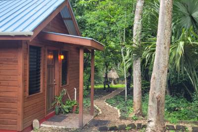 Our cabins are nestled in the garden, Balance Point Wellness Belize, Bullet Tree Falls